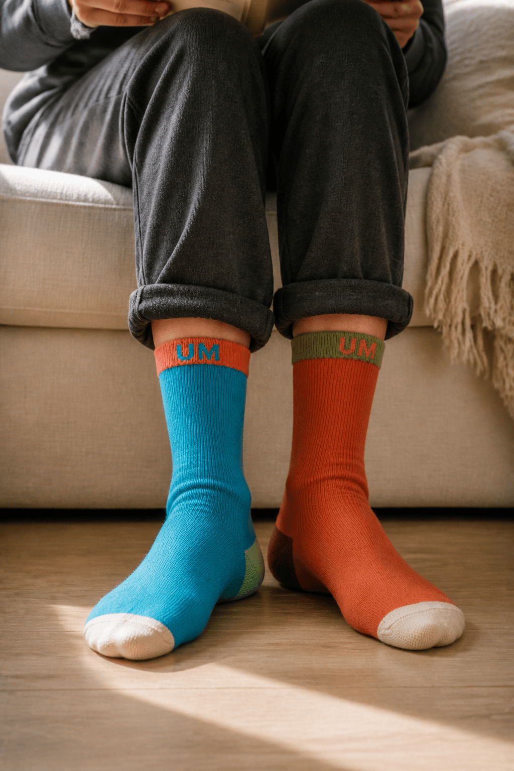 Quiet moment at home in Coastal Breeze and Desert Clay UNMATCHED socks